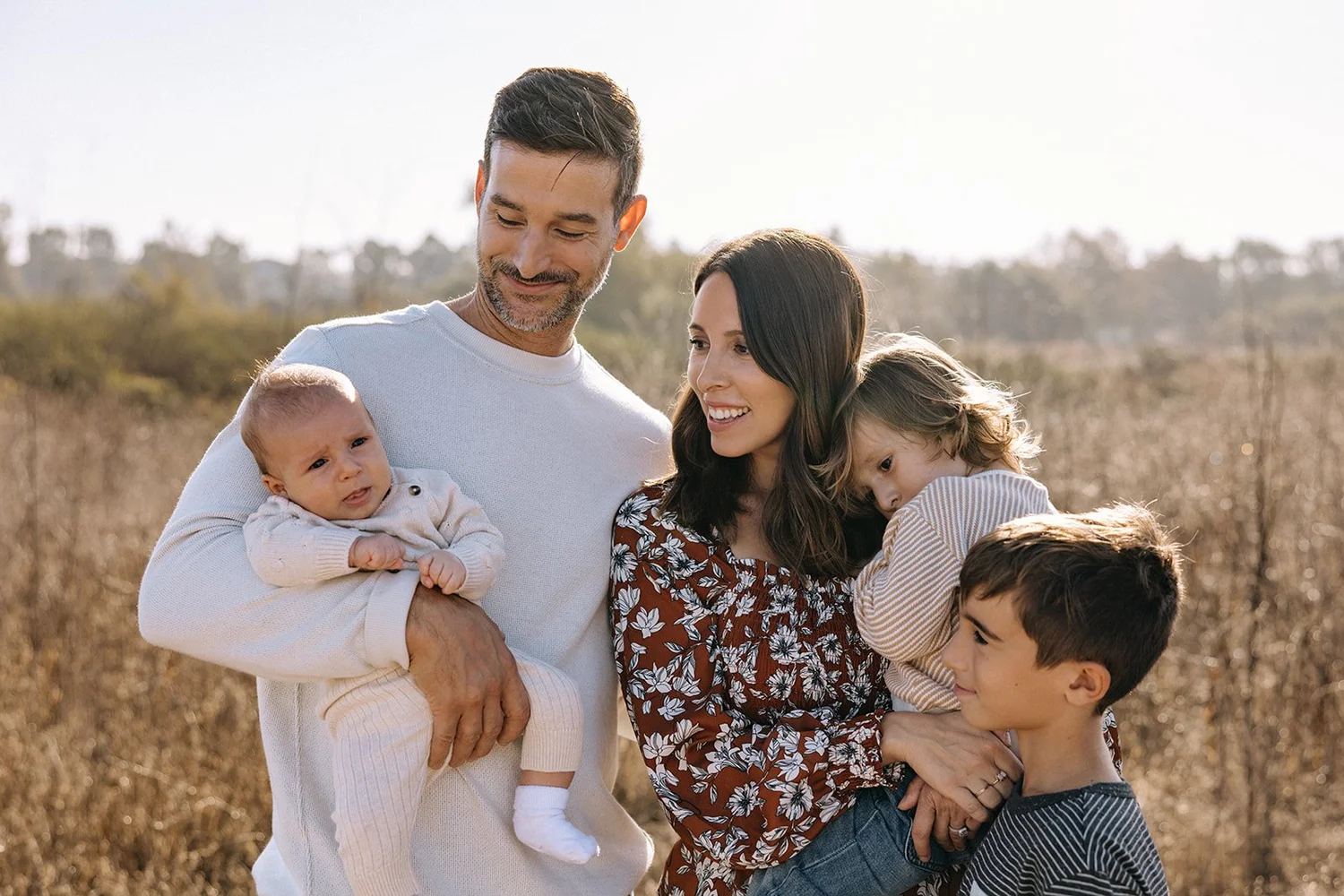 Dr. Nick Deliberato outdoors with his wife and their three children